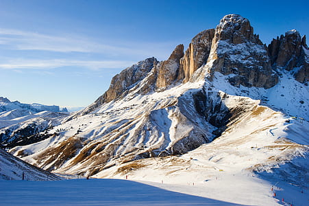 rock formation with snow during daytime thumbnail
