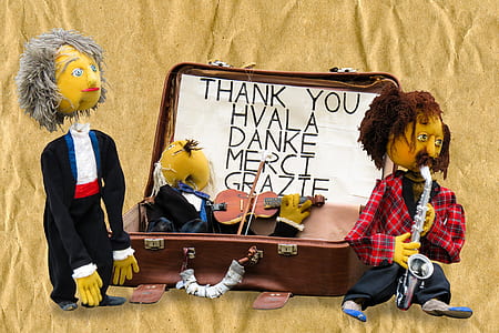 two men dolls on beige surface thumbnail