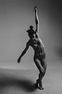 grayscale photo of woman doing exercise thumbnail