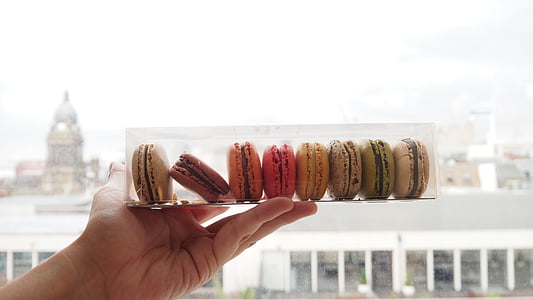 person holding eight cookies thumbnail