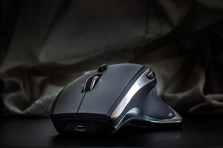 close-up photography of black and grey track ball mouse thumbnail