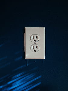 white switch plate on blue wall thumbnail