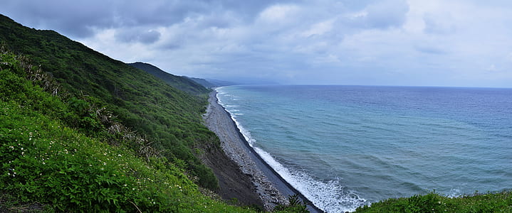 gray hills surrounded of body of water thumbnail