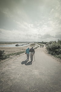 selective color of two person walking on road thumbnail