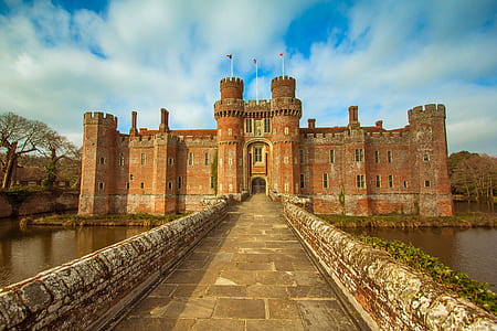 red castle near body of water thumbnail