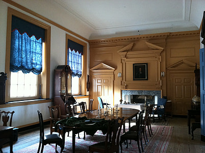 brown wooden dining set near opened windows with blue curtains thumbnail