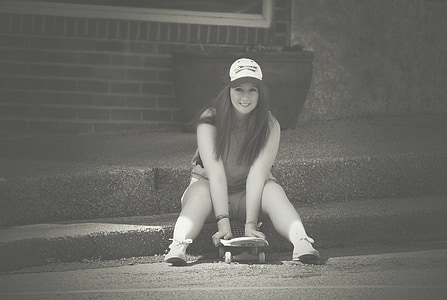 woman holding skateboard thumbnail
