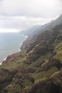 aerial photography of rock formation beside body of water thumbnail