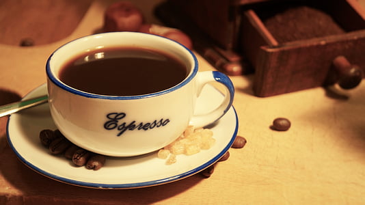 white and blue ceramic mug on saucer thumbnail