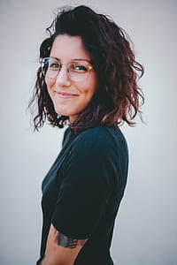 woman in black T-shirt and wearing eyeglasses thumbnail