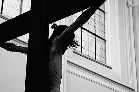 grayscale photography of Jesus Christ with cross statue thumbnail