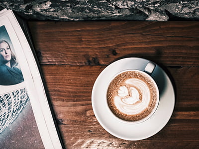 cappuccino on white ceramic cup and saucer thumbnail