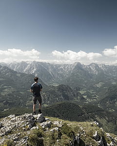 man standing on mountain range thumbnail