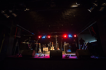 man standing on stage thumbnail