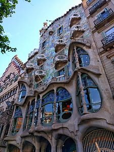 low-angle photo of brown and multicolored multi-story building at daytime thumbnail