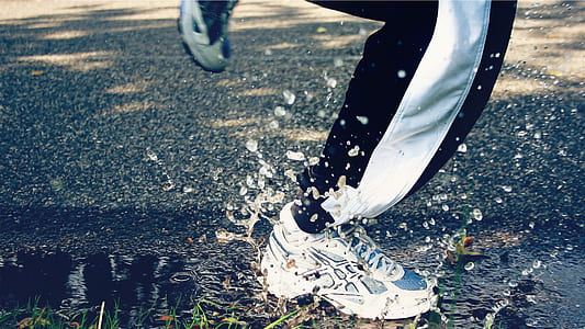 pair of white Asics sneakers thumbnail