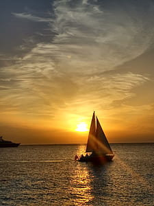 silhouette of sailing boat during sunrise thumbnail