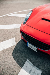 Side view of a red sports car with chrome front grill thumbnail