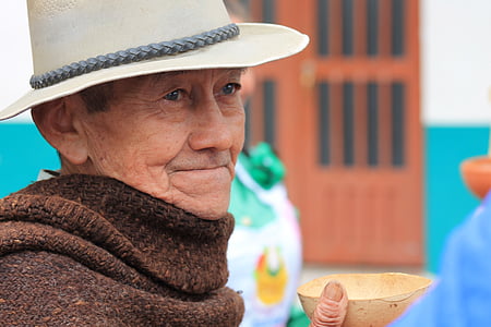 selective focus photography of man in white hat thumbnail