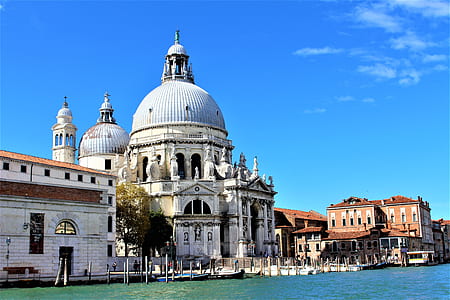 white concrete dome structure building under blue cloudy sky thumbnail