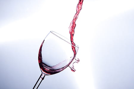 wine poured on clear wine glass in sideways thumbnail