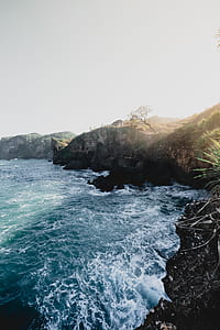 photo of cliff near body of water thumbnail