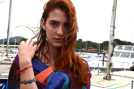 woman wearing blue and red dress taking selfie thumbnail