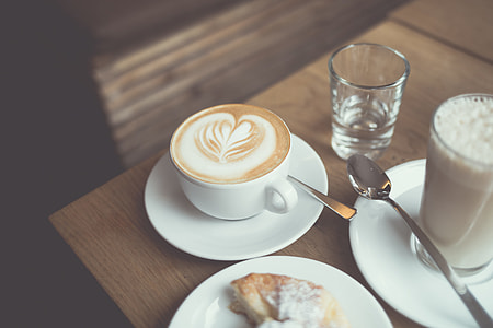 white ceramic teacup filled with coffee thumbnail