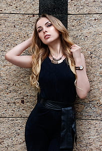 woman wearing black sleeveless dress thumbnail