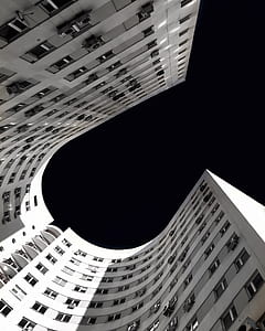 white concrete building under black sky during nighttime thumbnail