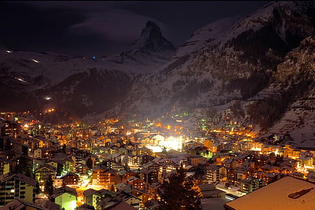 houses beside mountains filled of snow thumbnail