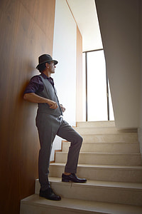 man standing on stairs thumbnail