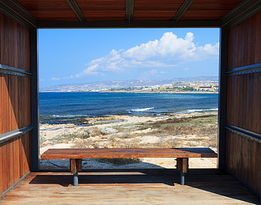 brown wooden bench in the beach thumbnail