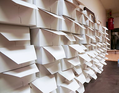 A stack of donut boxes in a warehouse thumbnail
