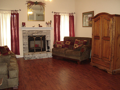 brown wooden cabinet beside loveseat thumbnail