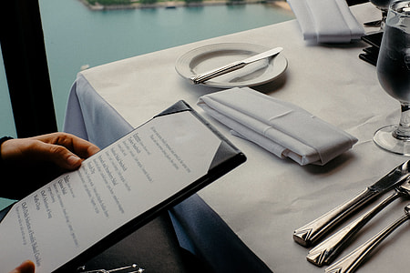 Looking at the menu in restaurant thumbnail