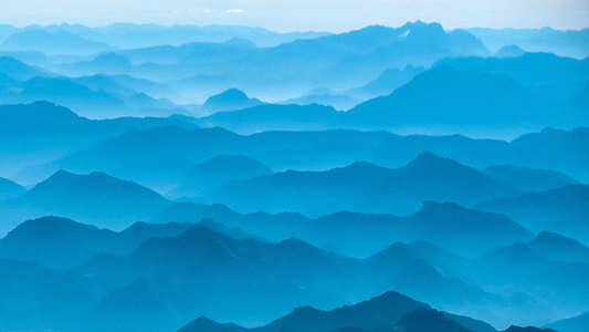 Mountain Silhouettes in the Mist in the Brandenburg Alps, Austria thumbnail