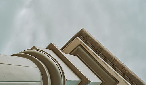 White Concrete Pedestal Column Facing the Rainy Sky thumbnail