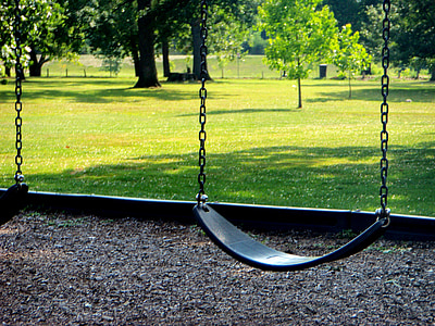 close-up photo of blue swing during daytime thumbnail