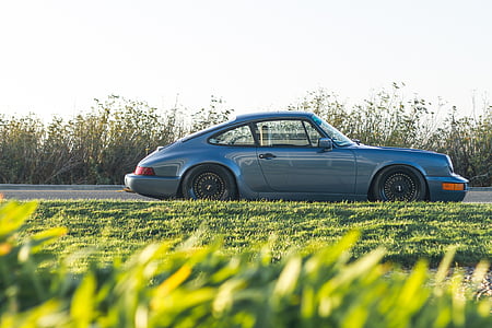 gray coupe beside green lawn thumbnail