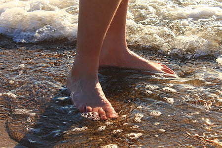 person standing on seashore at daytime thumbnail
