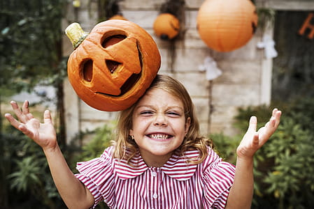 Orange Pumpkin on Girl's Head thumbnail