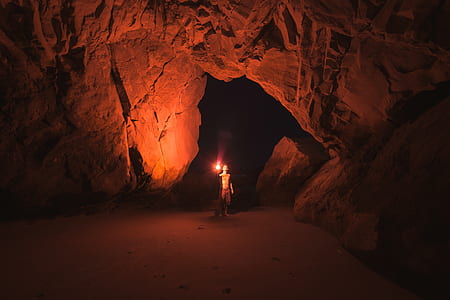 man holding torch photo thumbnail