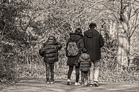 grayscale photo of family walking o thumbnail