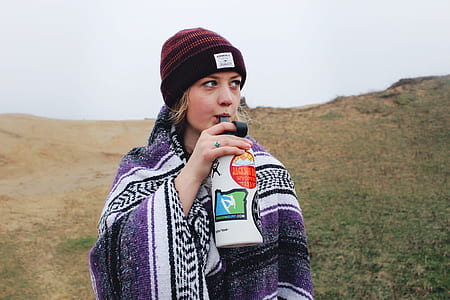 woman drinking through jug thumbnail