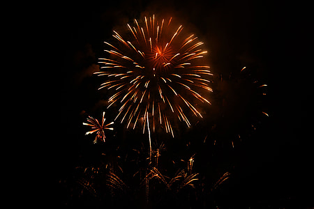 orange fireworks on pitch dark sky thumbnail