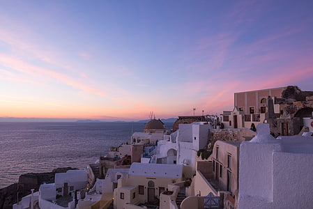view of Santorini in Greece under dark sky thumbnail