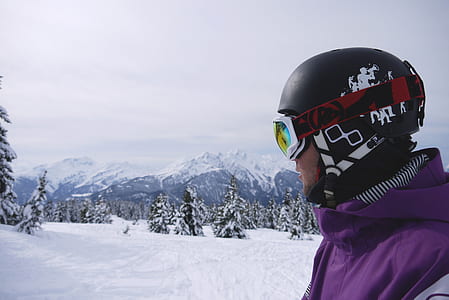 man wearing purple zip-up jacket during daytime thumbnail