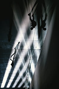 silhouette of people walking on hallway thumbnail