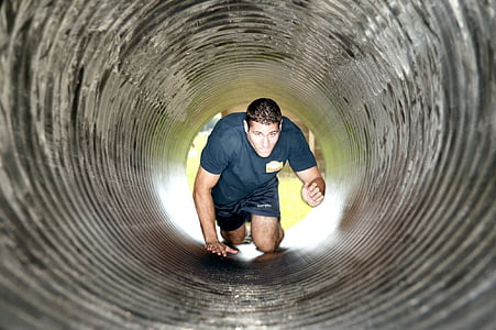 man crawling inside tunnel thumbnail